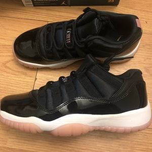 Black and pink/rose Jordan 11s